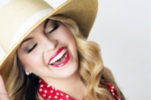 woman in a hat smiling