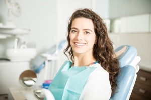 Young woman smiling at the dentist