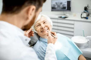 old lady smiling at the dentist