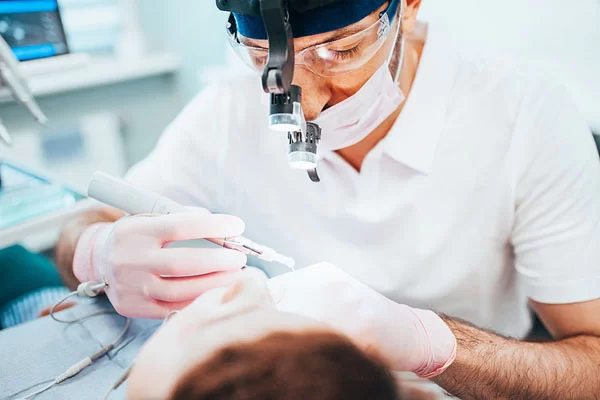 dentist performing dental treatment
