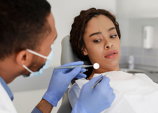 patient a bit afraid of the dental tools