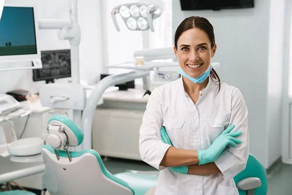 dentist standing in front of the dental room