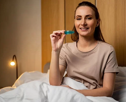 lady holding a MADs or oral appliance therapy